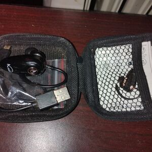 Black Wireless Bluetooth Earbud with USB Charging Cable